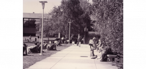 Students on campus with a view of the Student Center building in the background, circa 1980s.