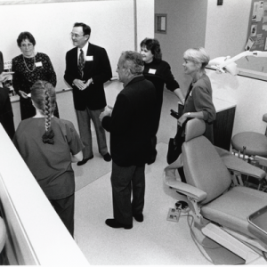 President Dimitry with others in a dental lab space at 45 Franklin Street, 1990s.
